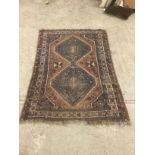 A Middle Eastern rectangular wool rug or carpet, 156cm x 123cm