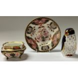 A Royal Crown Derby paperweight, Rockhopper Penguin, gold stopper; an 1128 pattern trinket dish; a