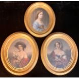 A set of three early 19th century hand tinted oval portrait engravings, ladies of fashion, 28cm x