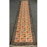 A North-west Persian Ardebil wool and silk runner, knotted in shades of warm cream, coral, and