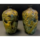 A pair of Chinese after the antique bronze coloured metal vases, relief cast with birds amongst