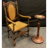 A Victorian Jacobean revival armchair, carved cresting, scroll arms, barley twist supports,