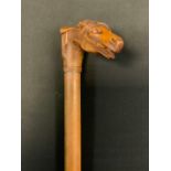 A Victorian walking stick, the handle carved with horses head and saddle, 89cm long, c.1890