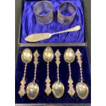 A set of six Victorian silver aesthetic movement teaspoons, cased; a silver napkin ring; etc (qty)