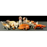 A Beswick model curled Fox; others Hunting Hounds, Terriers; Royal Doulton Jack Russell terriers