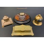 A 19th century ebonised pressed glass inkwell; others brass; stamp box etc (4)