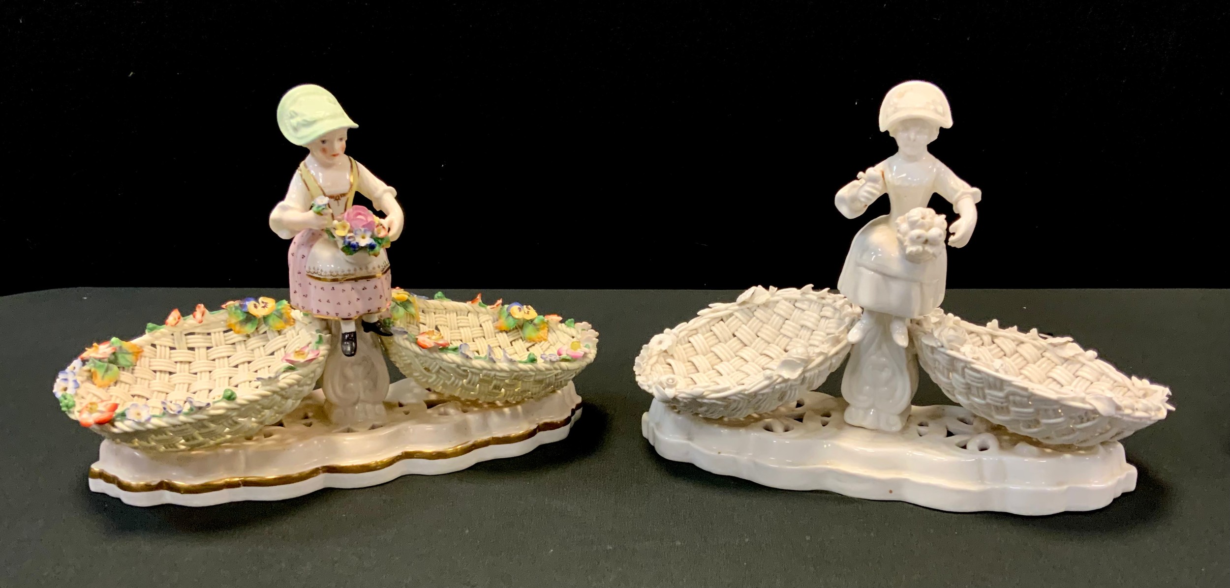 A Sampson and Hancock Derby figural centrepiece, picked out in colours, two four strand baskets with