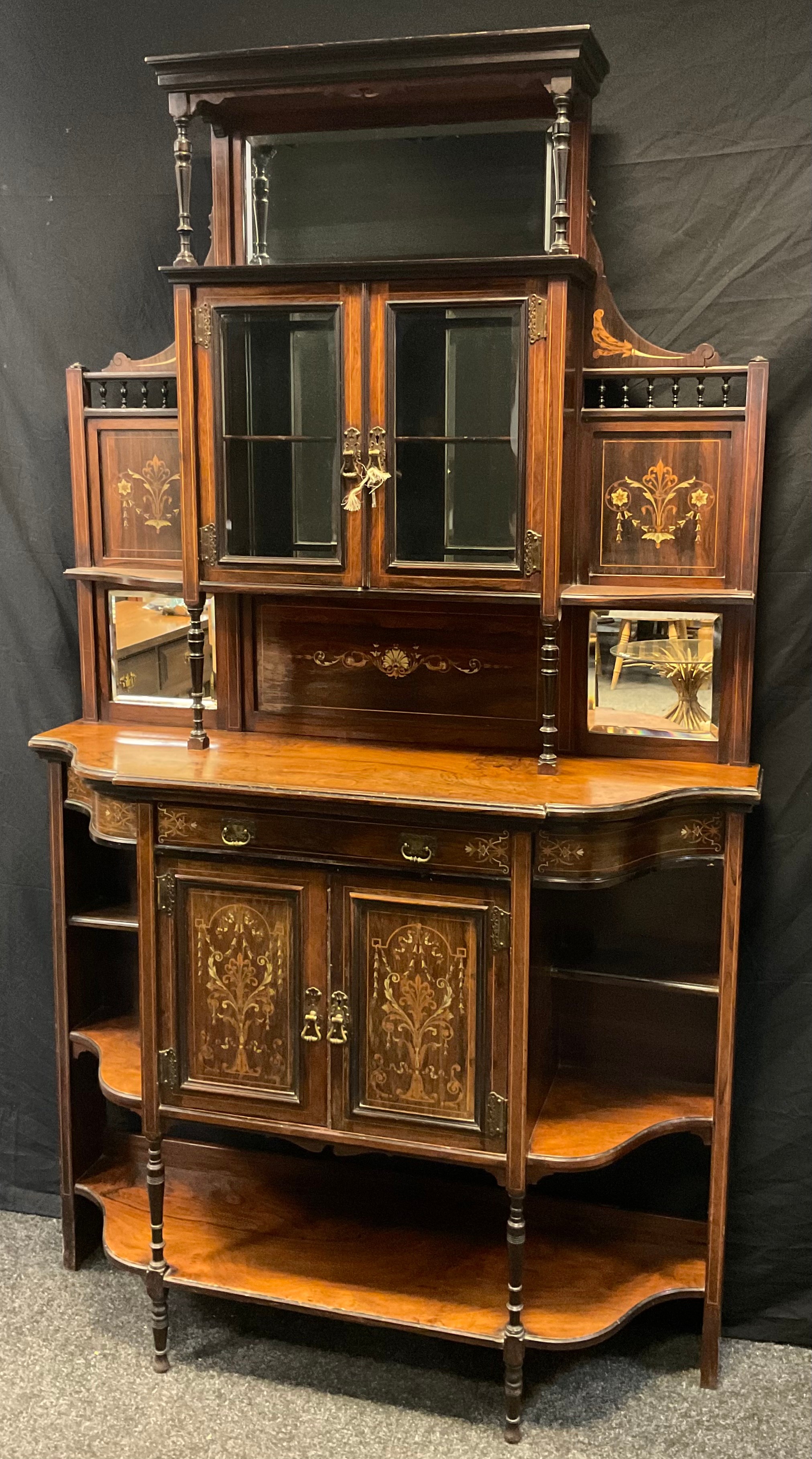 A Victorian Rosewood chiffonier by James Shoolbred and Company, 206cm tall x 122cm wide x 39cm deep,