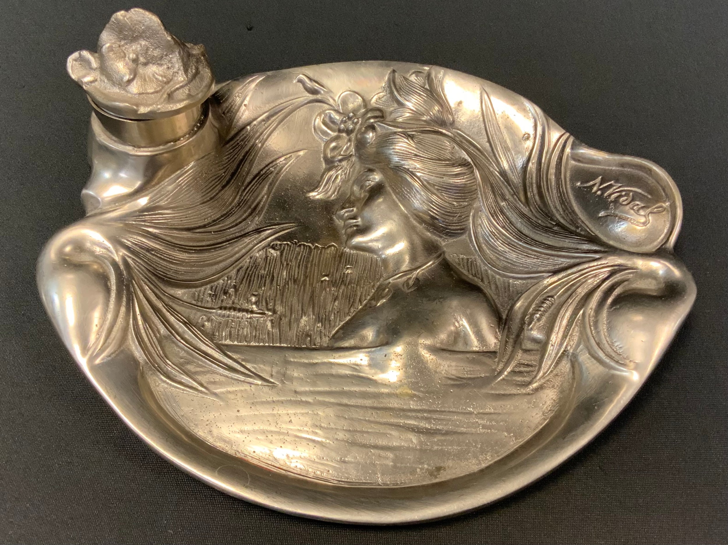 An early 20th century Art Nouveau inkstand, After N Vidal, cast water nymph and reeds, beneath a