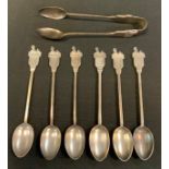 A set of six George V silver Egypt tea spoons and sugar tongs, Vaughton & Sons, Birmingham 1909-