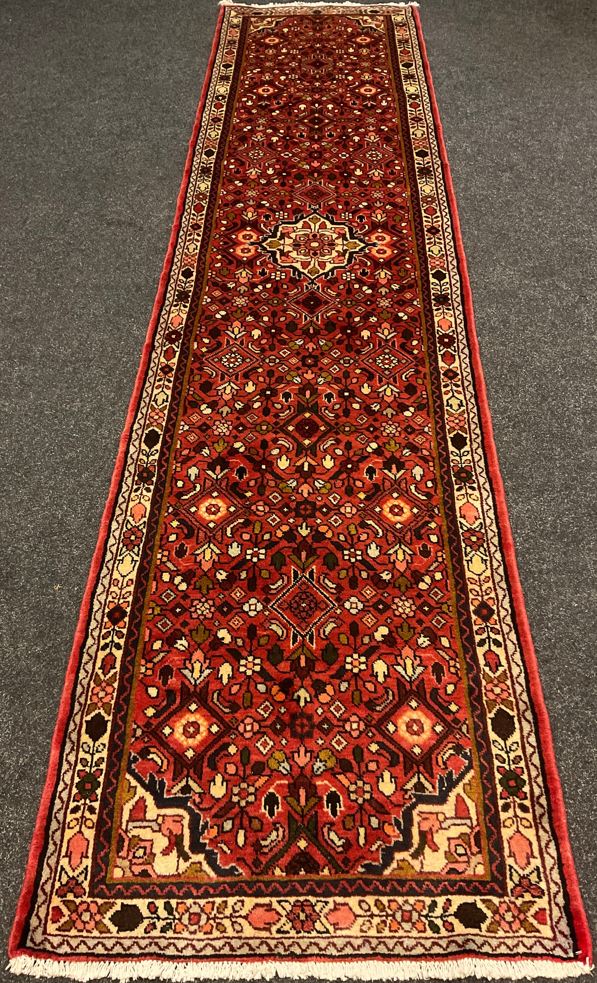 A North-west Persian Rudbar runner carpet, 354cm x 80cm.