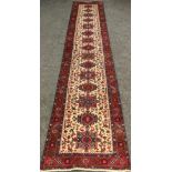 A North-west Persian hand-knotted Heriz Runner carpet / rug, 388cm x 79cm.