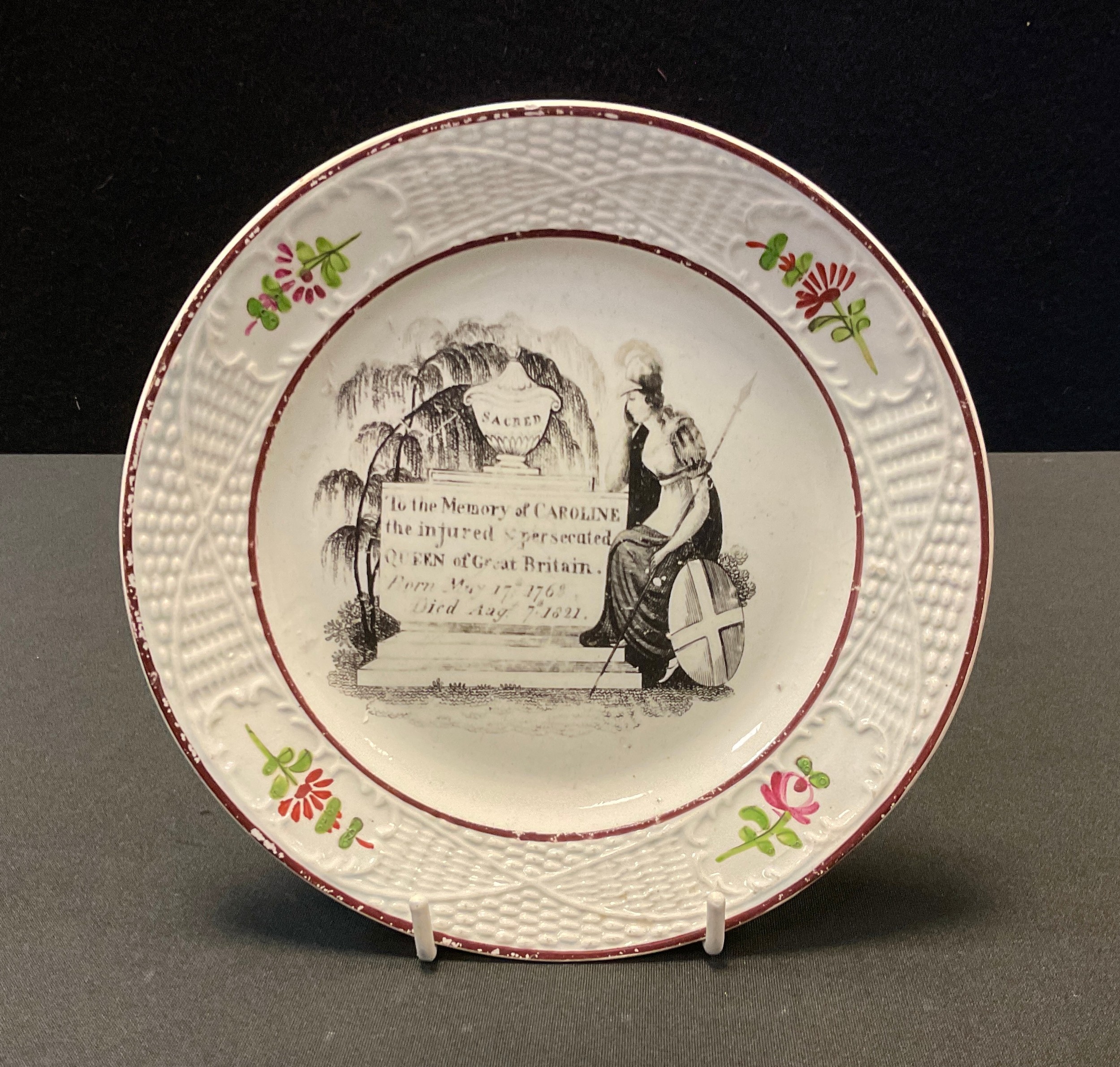 A 19th century pearlware child’s plate, commemorating the death of Queen Caroline printed in back