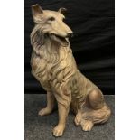 A large ceramic resin hollow cast model of a Rough Collie dog seated, 68cm high