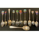 A pair of George III silver tea spoons, London 1806; others, various, later enamelled souvenir