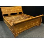 An exotic hardwood Sleigh bed, decorative specimen stone inlay, Super King size, 180cm x 200cm.