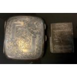 A George V silver cigarette case, chased floral scrolling decoration, Birmingham 1911, 85.4 g; a