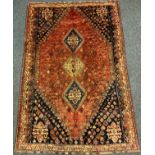 A South-west Persian Qashgai wool rug / carpet, hand-knotted with three diamond shaped medallions
