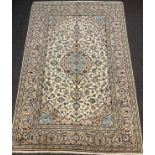 A Persian Kashan carpet, 295cm x 200cm.