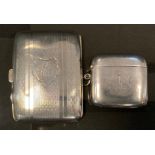 A George V silver cigarette case, engine turned banded body, Birmingham 1915; a vesta case,