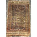 A Persian Baluch style woollen prayer rug, 132cm x 90cm; another, Persian woollen rug, central panel