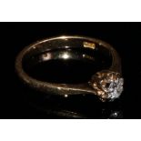 An 18ct gold diamond solitaire ring, the brilliant cut stone claw set in platinum, size L, 2.6g