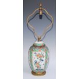 A Chinese famille verte ovoid vase and cover, painted with flowering branches within rectangular