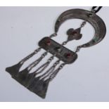 A Bedouin silver coloured metal necklace, the central rectangular tablet suspended from a