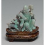 A Chinese carved opal figure group, Shou Lao and deer, inlaid hardwood stand, 7cm high overall