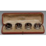 A set of four George V silver, tortoiseshell and pique oval menu holders, inlaid with game birds,