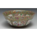 A Cantonese punch bowl, typically painted in famille rose enamels with figures in gardens and