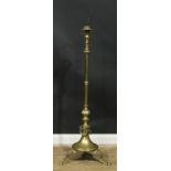 An early 20th century brass telescopic tripod floor lamp, inscribed FROM THE STAFF OCTOBER 14TH