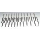 A set of twelve silver plated Old English Bead pattern table knives and twelve dessert knives,