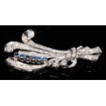 An early 20th century unmarked platinum brooch, as a ribbon tied leafy floral scroll, set with an