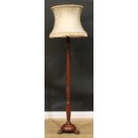 A George III Revival mahogany floor lamp, fluted column carved with acanthus and ears of wheat, ball