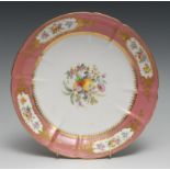 A Coalport circular dish, painted by Wm. Cook, with flowers and fruit, rose pompadour border with
