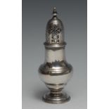 A George II silver pear shaped caster, pierced bell shaped cover with knop finial, crested, 15.5cm