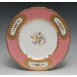 A Coalport shaped circular plate, painted by by Wm. Cook, with flower spray, the rim with three gilt