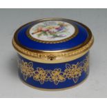 A Lynton porcelain circular table box, painted by Stefan Nowacki, signed, with a musical trophy,