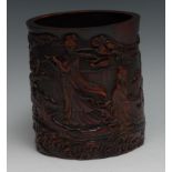 A Chinese bamboo bitong brush pot, carved in relief with Guanyin and immortals, 16.5cm high