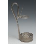 A Continental silver wine bottle holder, the circular coaster poerced with scrolling foliage, 28cm