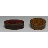 A 19th century vernis martin papier mache circular snuff box, decorated overall with leafy stems