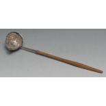 A George III silver toddy ladle, 31cm long, apparently unmarked, the bowl set with a Queen Anne