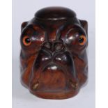 A Black Forest novelty table snuff box or inkwell, carved as the head of a bulldog, domed cover,