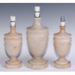 A garniture of three alabaster table lamps, the largest 33.5cm high under fitting (3)
