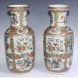 A pair of Cantonese famille rose roleau vases, painted with Chinese figures, butterflies, flowers