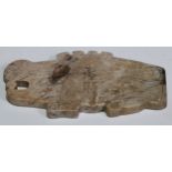 A Chinese Jade archaic type pendant, primitively carved as a mythical beast, 12.4cm wide, 6.5cm high