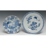 An 18th century Chinese circular plate, painted in tones of underglaze blue with figures on a