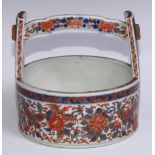 A Japanese bowl, in the form of a rice bucket, painted in the Imari palette, 21cm wide, Meiji period