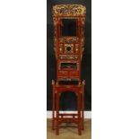 A Chinese parcel-gilt imitation cinnabar lacquer hall stand, shaped pediment pierced and carved with